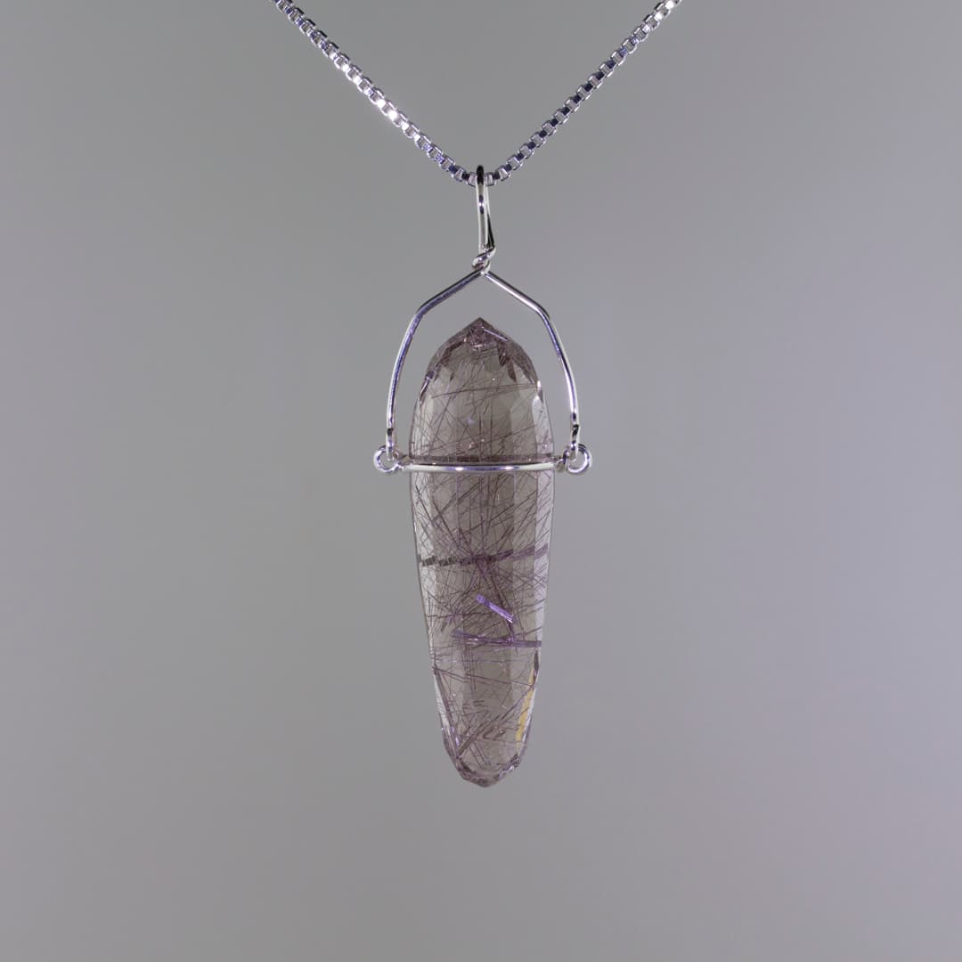 Faceting a Gemstone Pendulum to Feature Inclusions